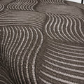 Close-up of the grey wave-textured breathable fabric used on the Customatic Independence luxury lift bed.
