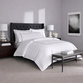 Soft white SleepTone Hotel Luxury sheets with silver embroidery for a cool and stylish sleep.
