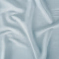 Close-up of light blue Hyper-Linen performance fabric texture by BEDGEAR for soft infant bedding.
