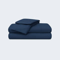 Folded navy blue BEDGEAR Ver-Tex sheet set featuring advanced heat-deflecting cooling technology.

