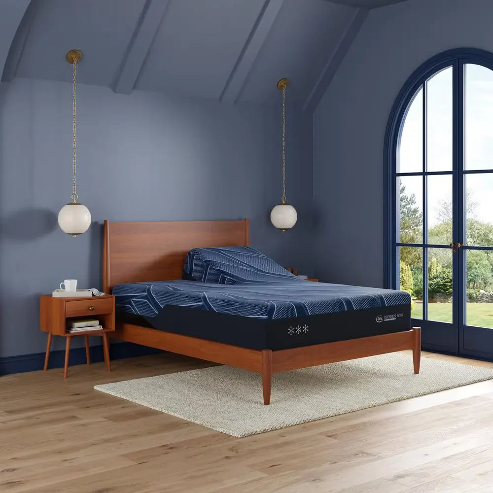 Perspective view of the Serta iSeries NXG 3500 hybrid mattress on a split adjustable bed base.
