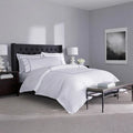 SleepTone Hotel Luxury 6-piece white sheet set with grey embroidery in a curated master bedroom.
